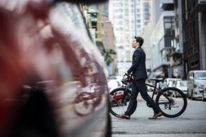 Chinese businessman commuting to work on a bicycle